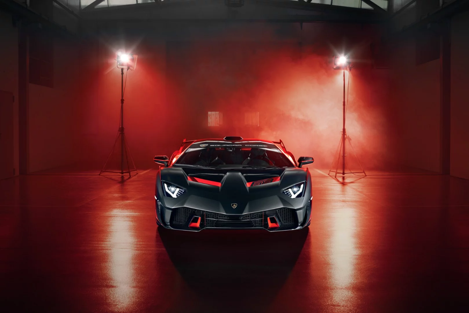 The SC18 Alston's cockpit features carbon fiber bucket seats, and is upholstered in black Alcantara microfiber material with red cross-stitching