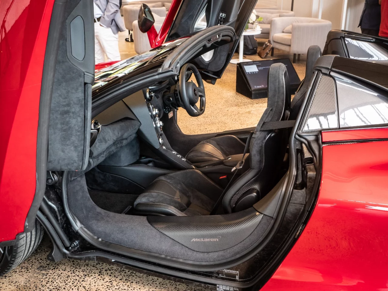 The carbon monocoque frame has been redesigned for the convertible, and it looks so empty with the doors open you have to wonder if it'll flex in hard cornering