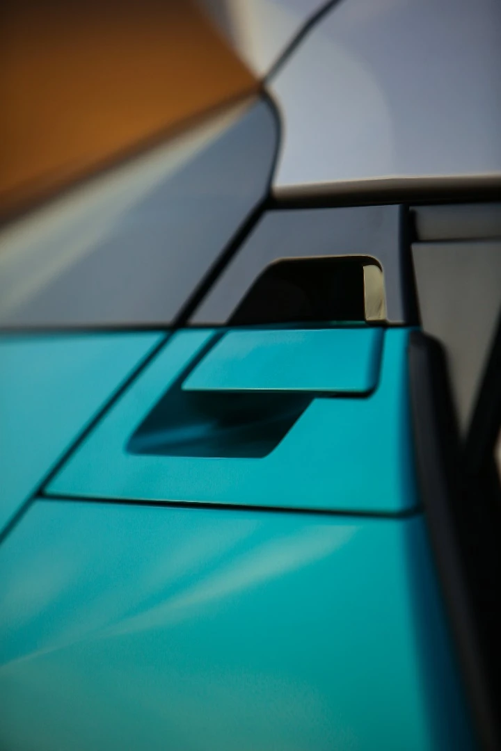The rear door handles are high up and back, leaving the bodywork smooth to create the design of a "coupe," hence the C-HR's name, "Coupe High Ride"