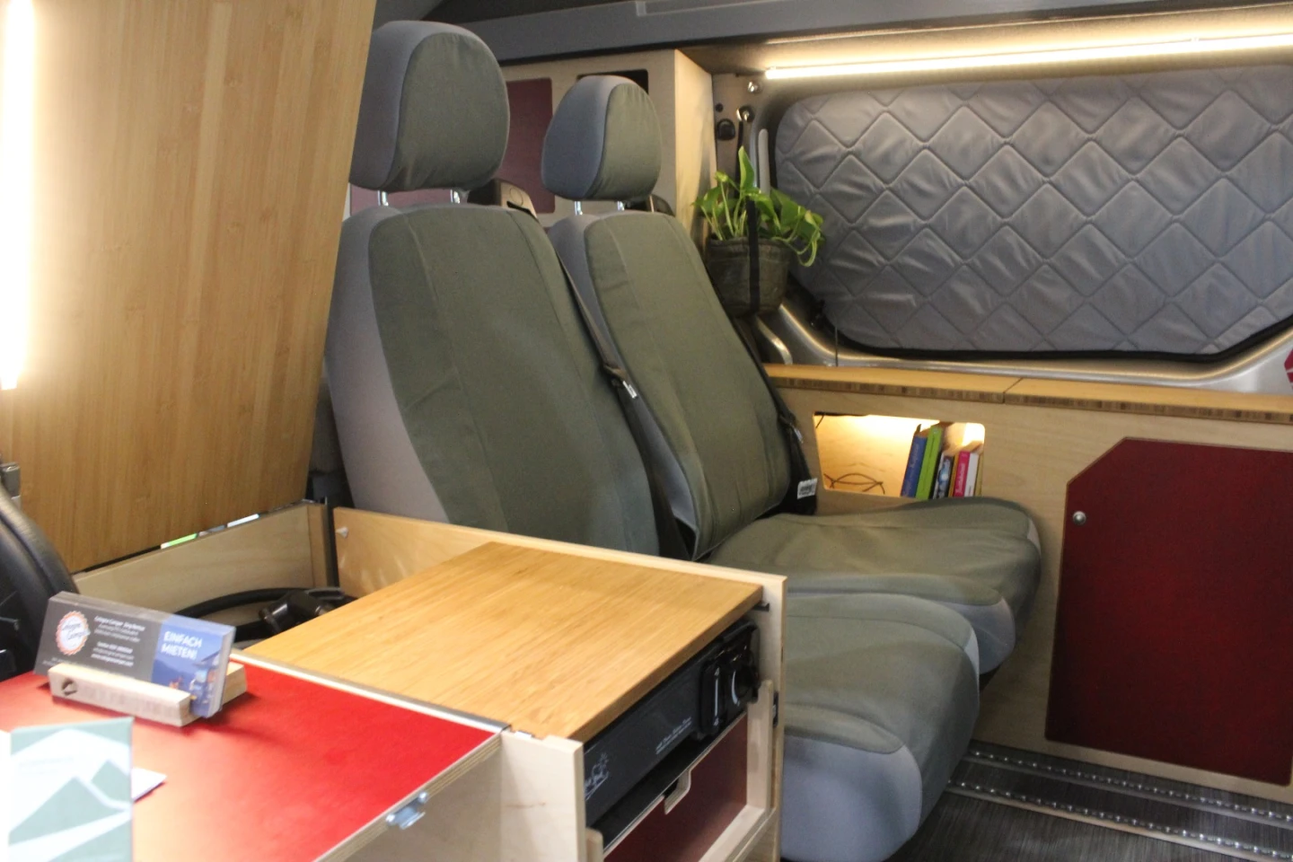 In place of the rear bench seating on other camper vans, Kompanja uses two individual rear seats