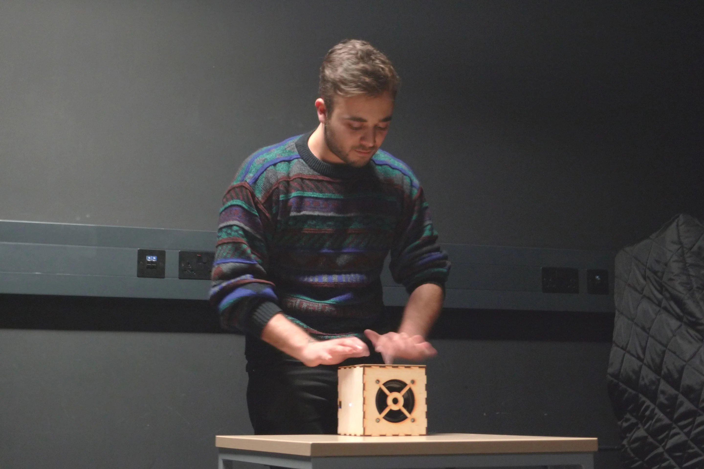 Classical guitarist Michael Poll tries out the experimental digital music cube