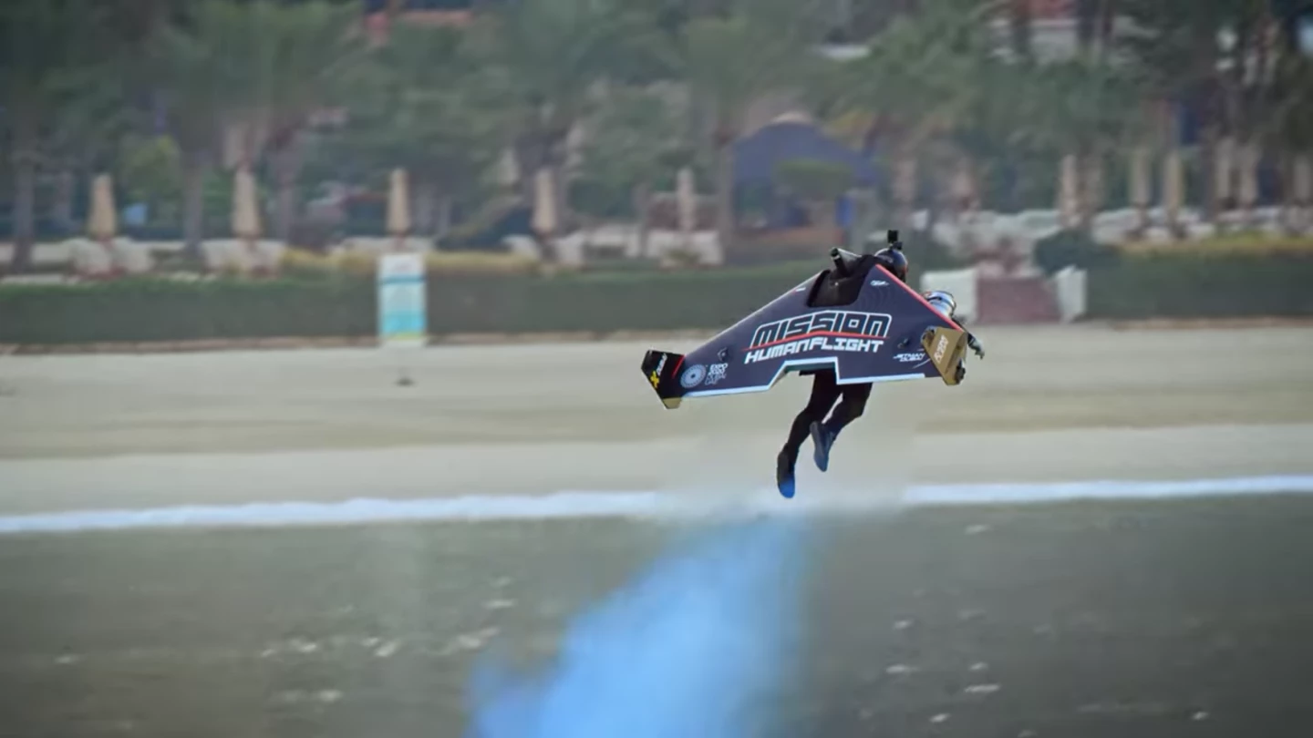 Jetman pilot Vince Reffet takes off from the ground before soaring off into the distance in a world-first transition from VTOL to winged flight