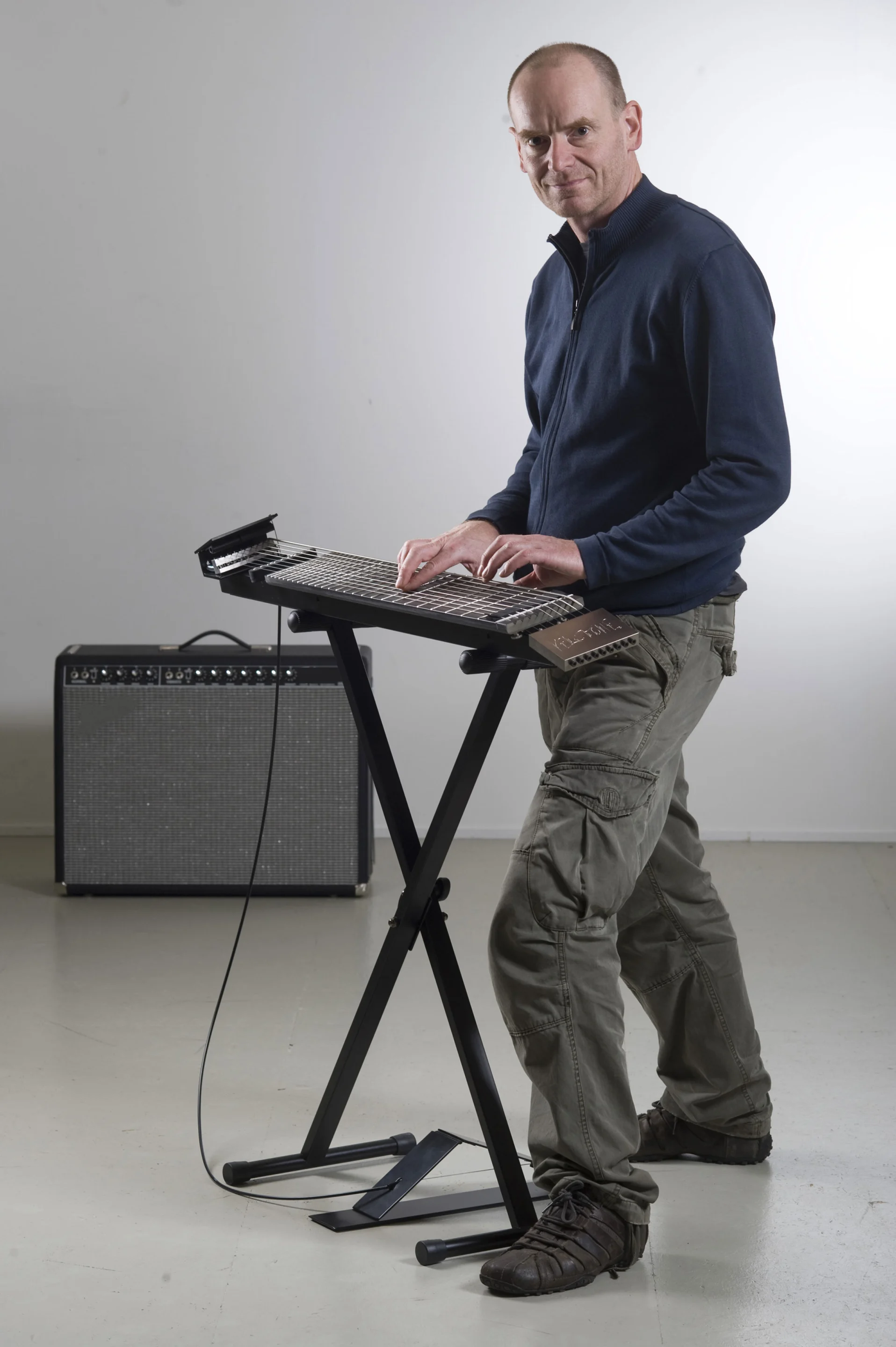 The Kelstone 9-string instrument can be played using both hands, like a piano