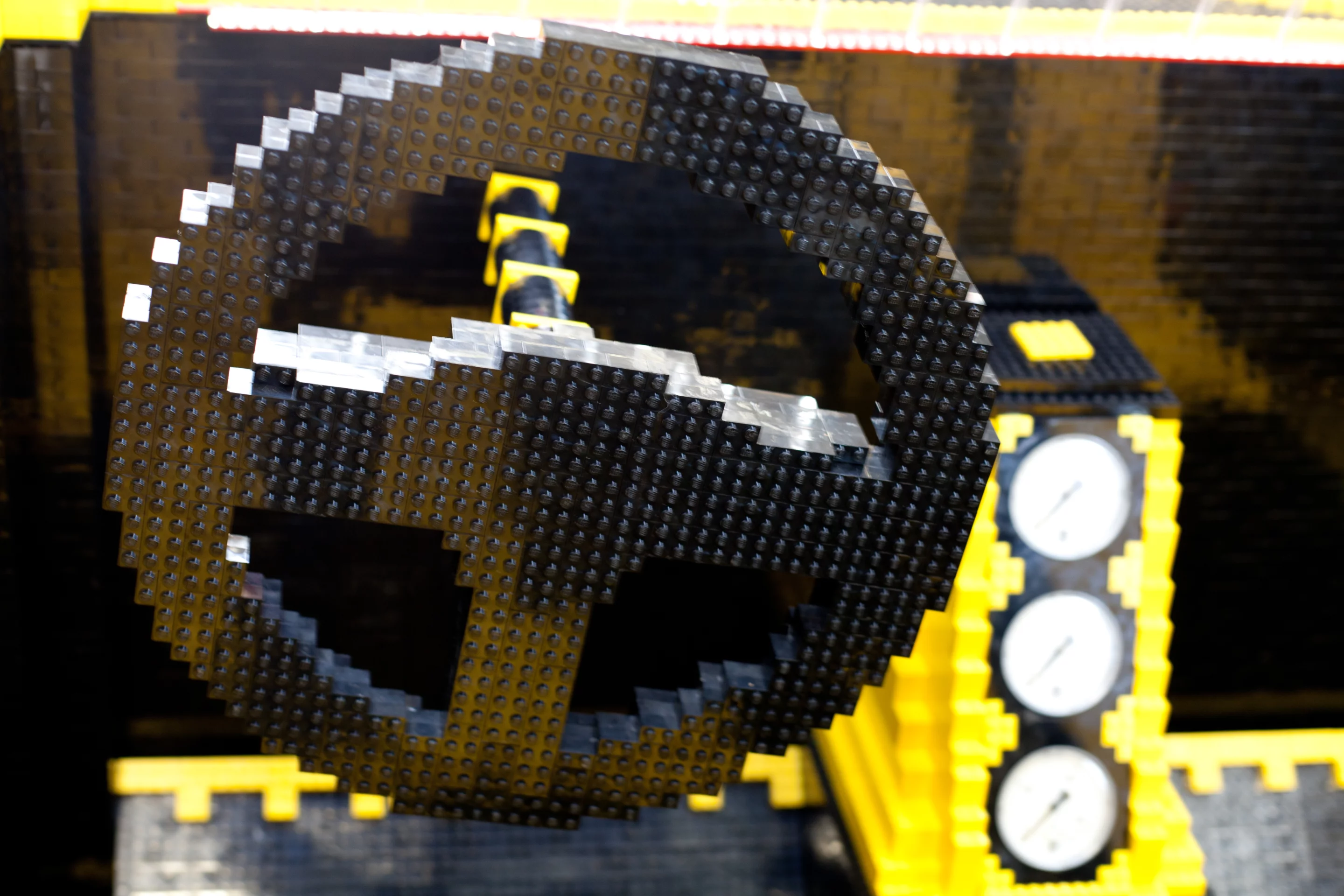 The steering wheel is Lego but the gauges monitoring the engine's air pressure and outputs are off the shelf items