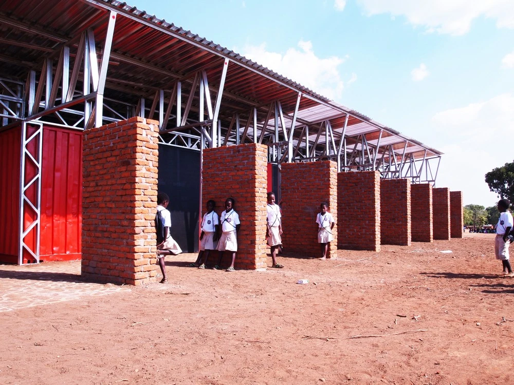 The container roofs are angled to encourage rainwater to fall into gutters which then channel into water tanks (Photo: Architecture for a change)