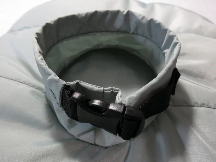 The BarkerBag features a cinchable collar to keep dogs restrained during sleep