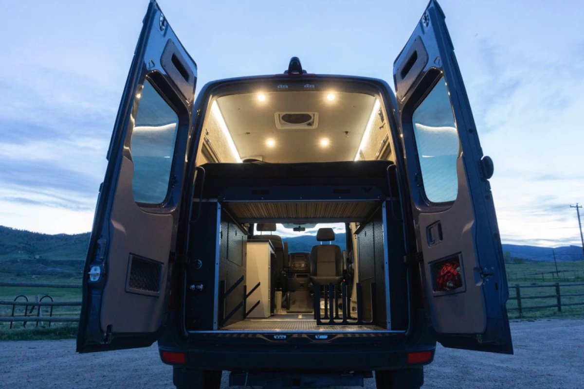 The base package brings the bed, power and lighting, and the Skier/Surfer pack adds the gear racks, water heater and more
