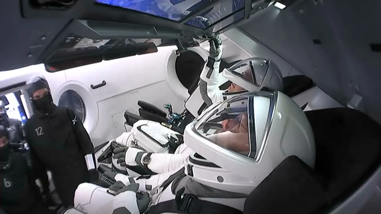 NASA’s SpaceX Demo-2 crew members Douglas Hurley, foreground, and Robert Behnken, inside the SpaceX Crew Dragon spacecraft at Launch Complex 39A
