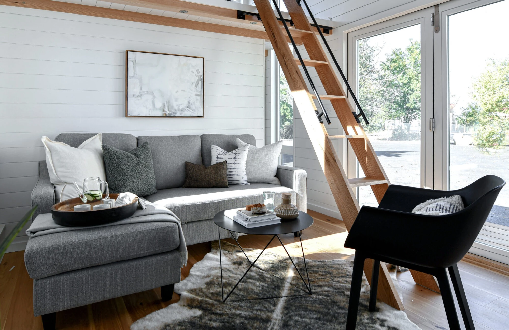 The Urban Park Studio's living room is arranged around a large L-shaped sofa bed