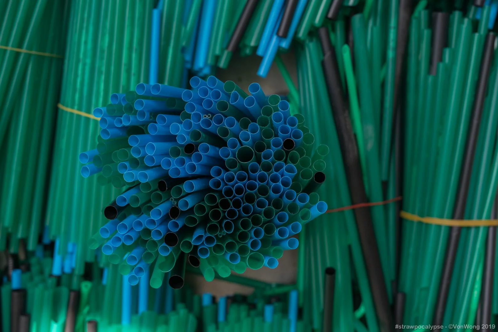 Organized plastic straws during construction of the Strawpocalypse installation