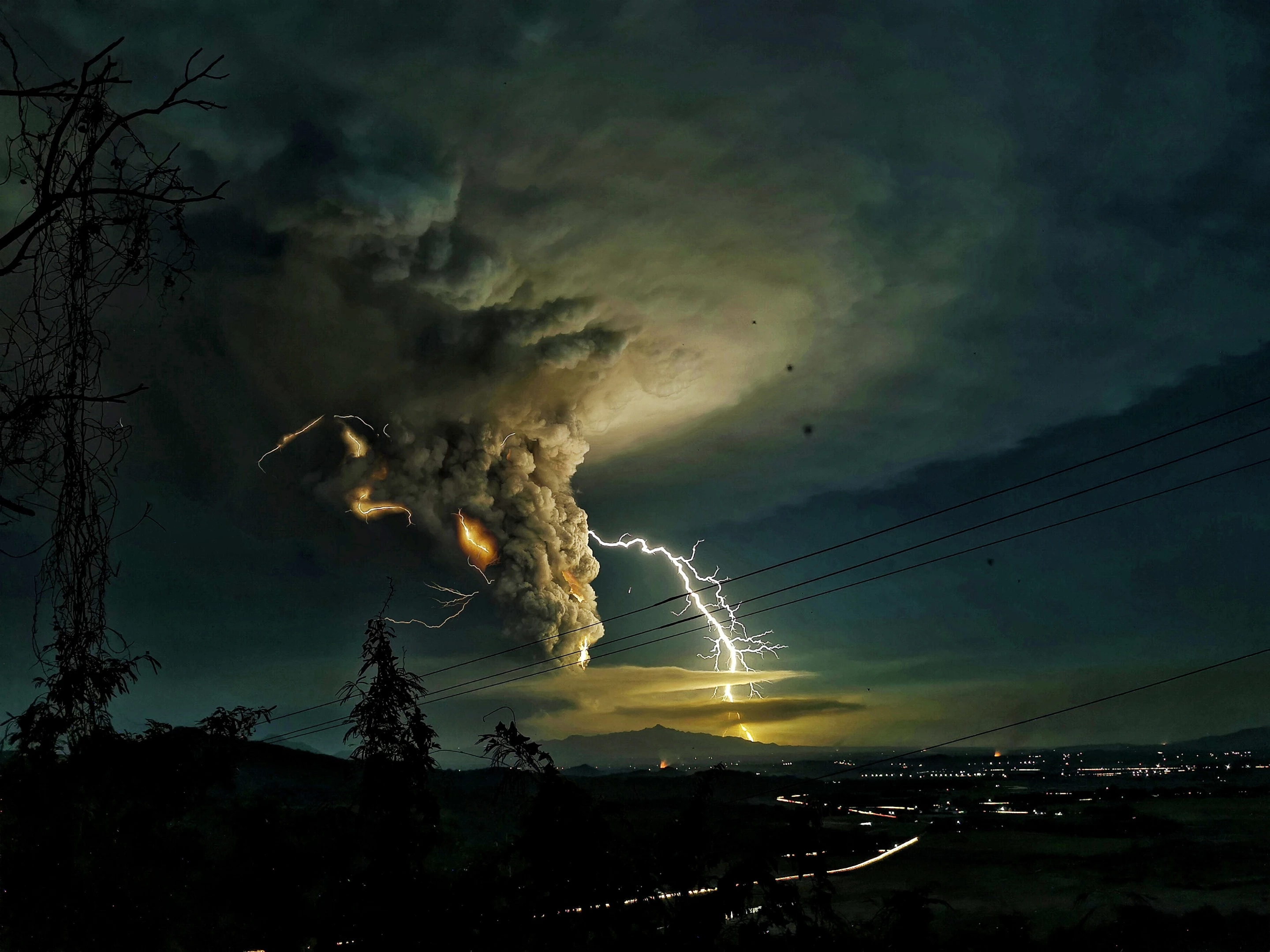 Honorable Mention, Nature. Streaks of lightning blazed through columns of ashes amid Taal Volcano’s eruption as seen from Nasugbu, Batangas, Philippines