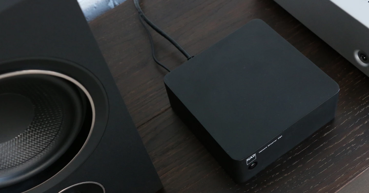 The NAD CS1 connects to a home network via Wi-Fi 5 or Ethernet LAN and then to a legacy hi-fi system via RCA outputs, or to powered speakers over optical/coaxial