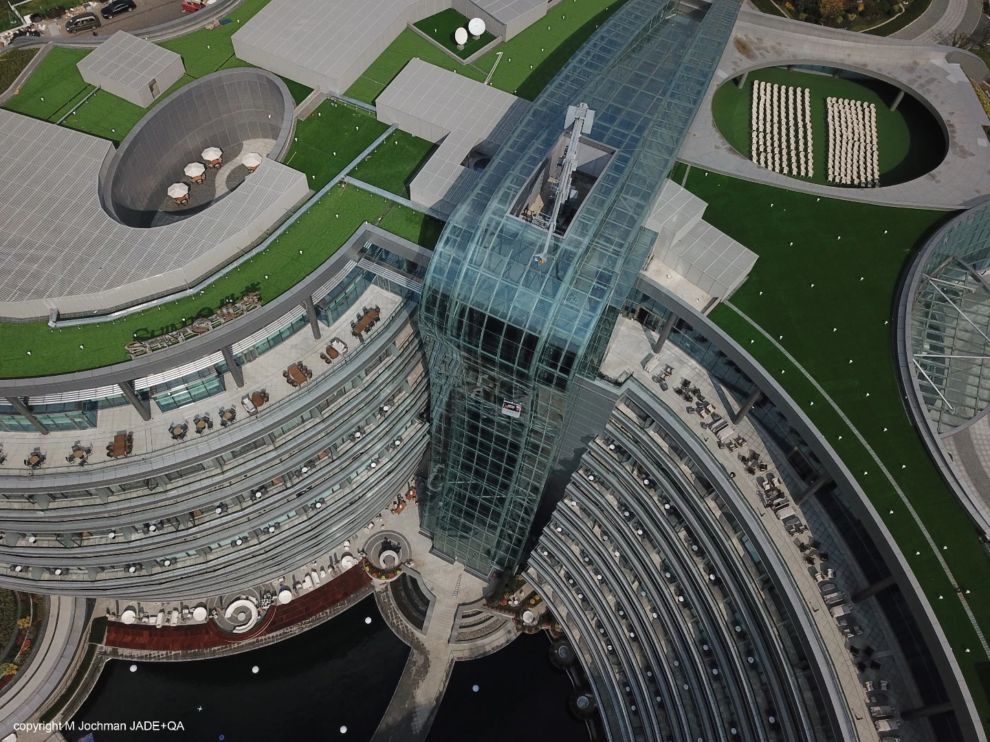 The Shimao Wonderland Intercontinental Hotel is divided by a massive glass "waterfall" that houses the elevator atrium