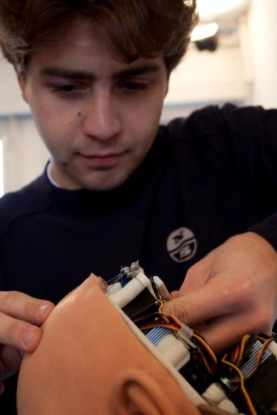 Thirty-two servo motors are integrated in the android skull and neck