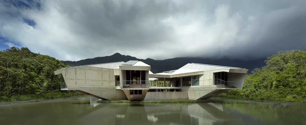 Constructed on a small patch of land in the middle of a pond, much of the Stamp House is comprised of a mixture of new and used concrete, which provides insulation to keep the temperature more constant throughout the year