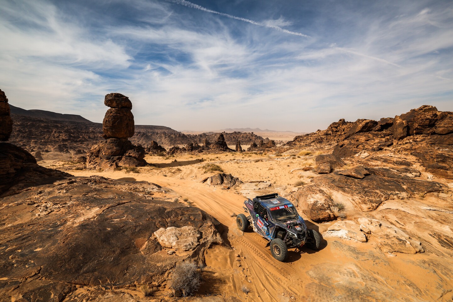 A. Vincent really captured what it's like to race the Dakar in Saudi Arabia. The landscape is diverse and challenging, from dunes to balancing rocks. Here is Spaniard Fidel Castillo (#415) and Argentine Anuar Osman in their Can-Am for Bujarkay-Makarthy Racing in the SSV T4 class. Together, they finished 9th overall in their category