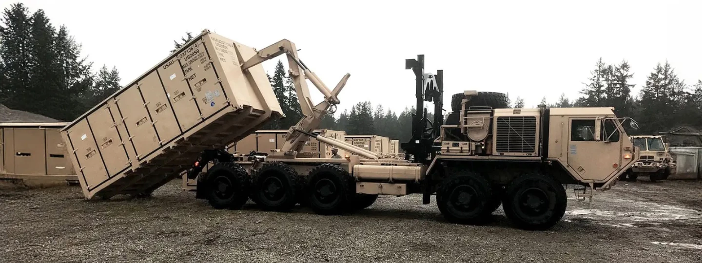 Without leaving the cab, a PLS operator can load or unload the truck and trailer in under five minutes