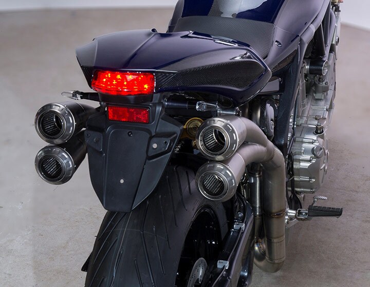 PGM V8 motorcycle: Twin 4-2-1 exhausts with dual end cans, custom designed by Akrapovic