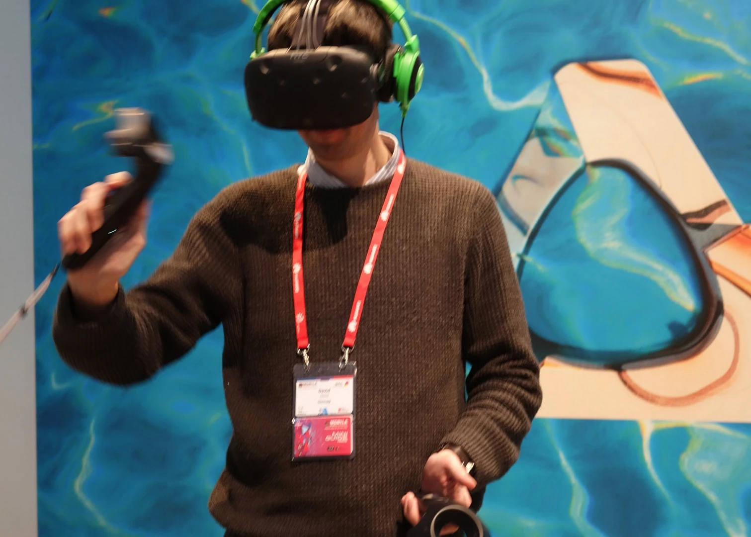 What you don't get with your HTC Vive are headphones: these bright green ones were supplied as part of the demo