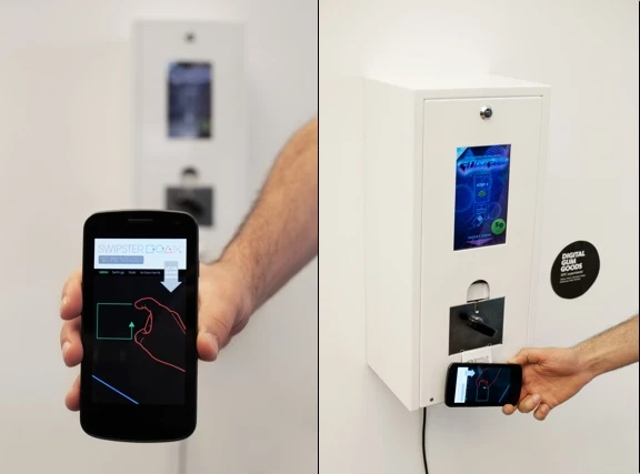 The machine delivers random digital content - such as apps, movie trailers, songs or e-books - to the smartphone placed near the release shoot