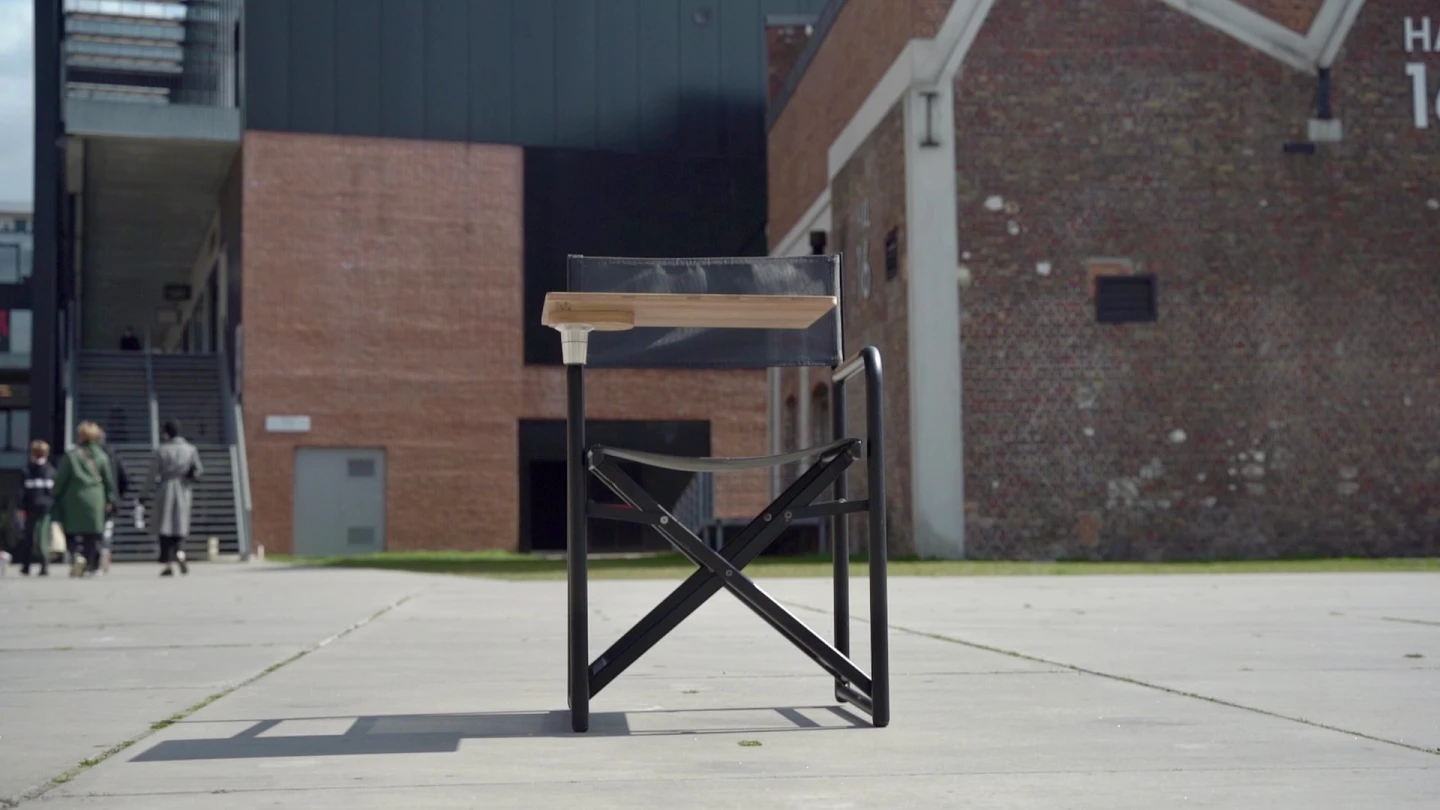 While other employees go indoors, the chAIR user gets things done outside