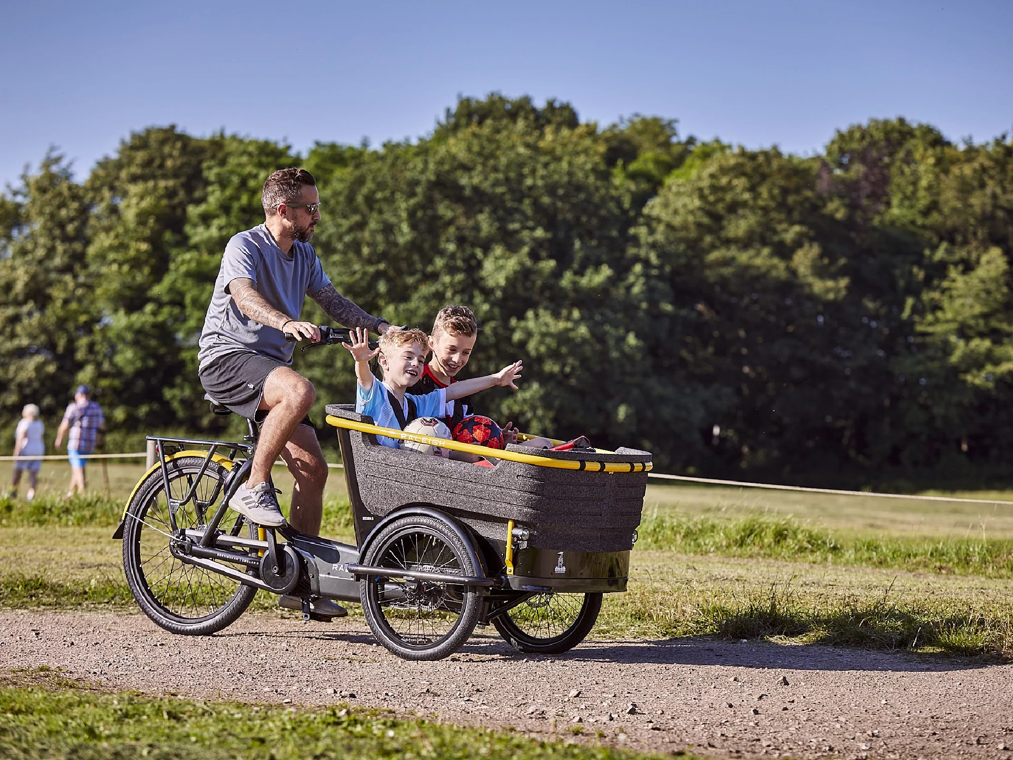 The Raleigh Stride 3 cargo e-trike features a front cargo box that's big enough for up to four young children