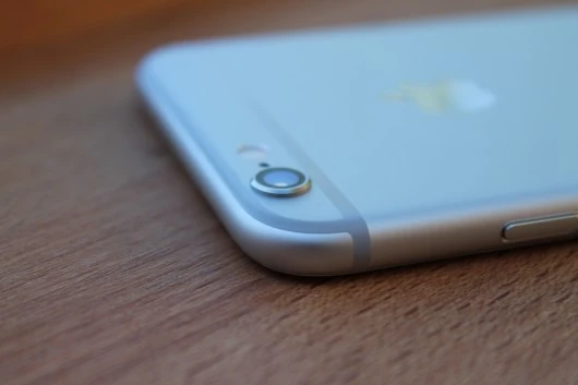 The iPhone 6 camera lens protrudes from the back