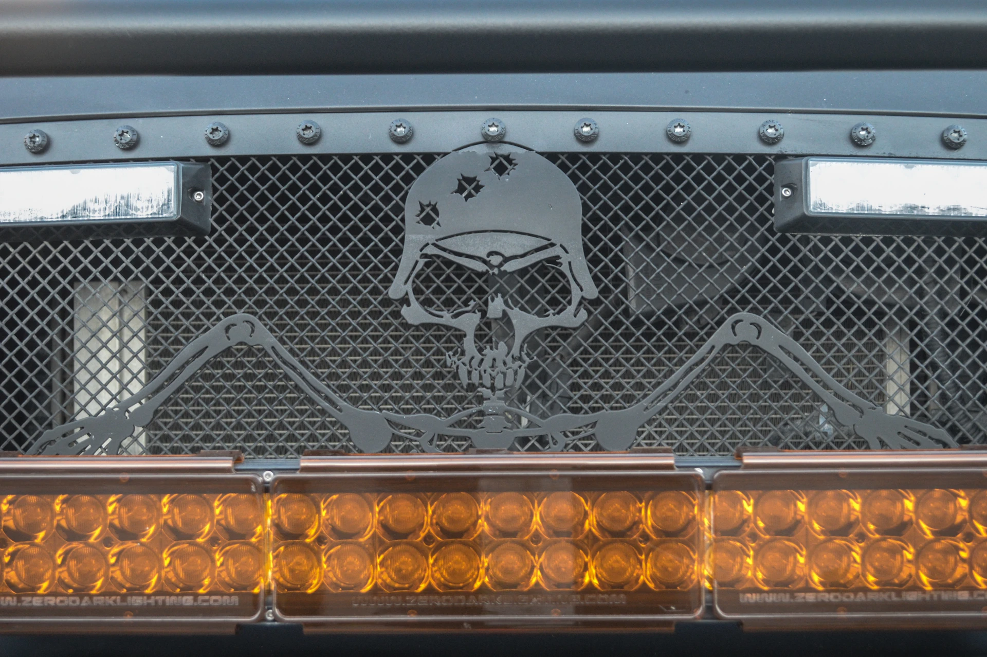 Right next to Survivortruck.com's tent truck, this smaller truck camper had a horror-inspired look (Photo: C.C. Weiss/Gizmag)