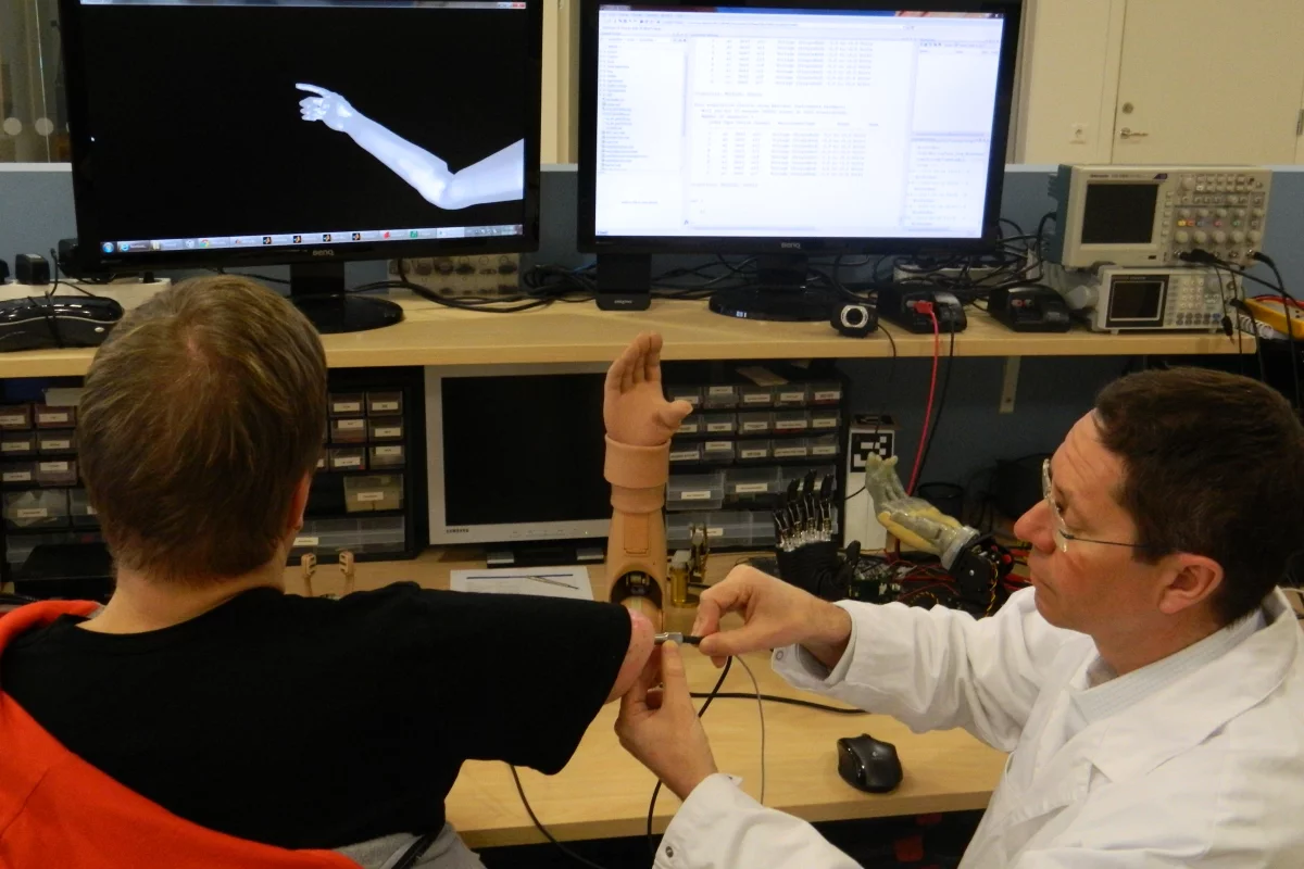Dr Rickard Brånemark tests the functionality of the world's first muscle and nerve controlled arm prosthesis permanently implanted in an amputee