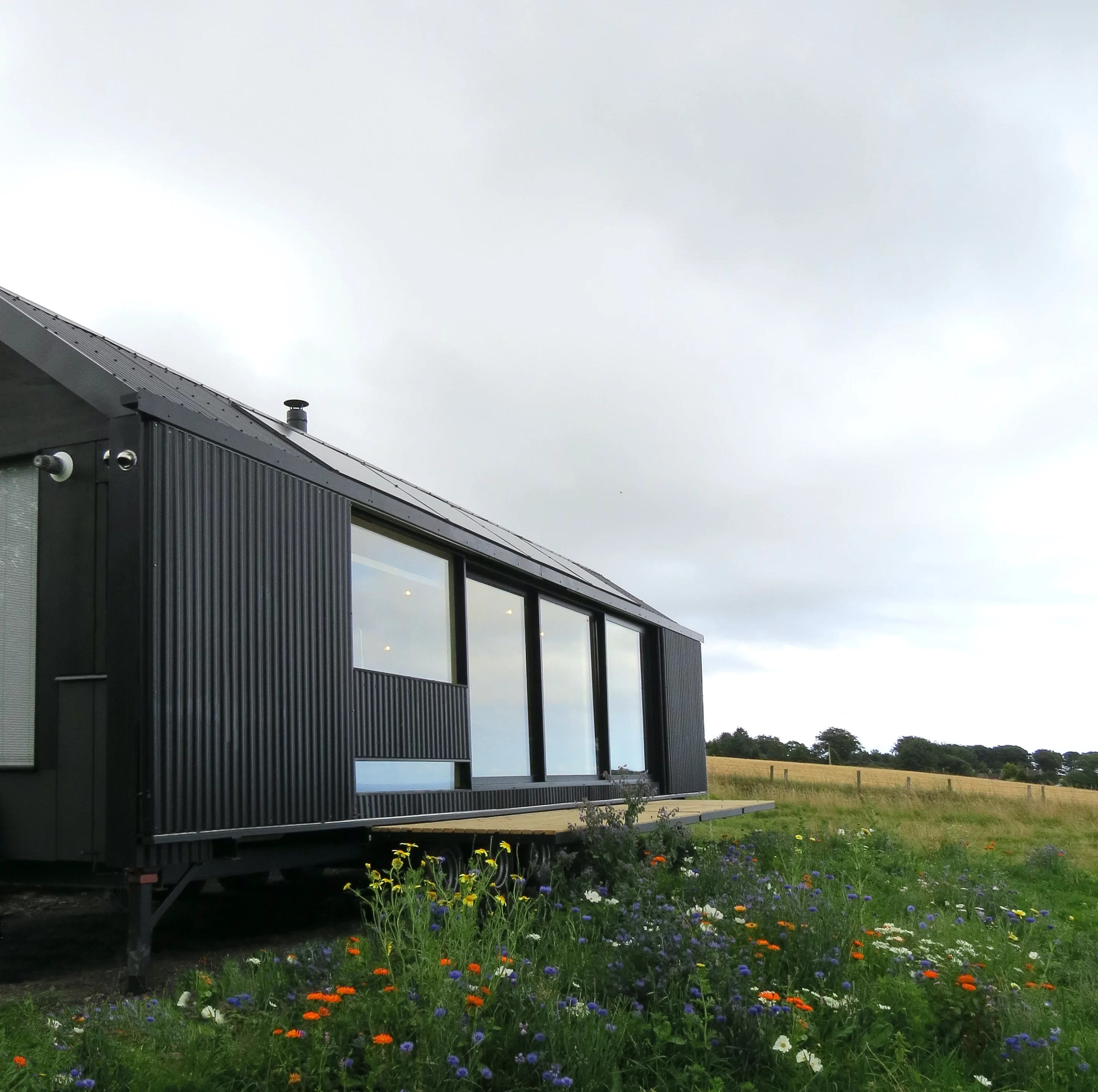 The Long Shed includes a retractable deck area that's stowed away when not in use
