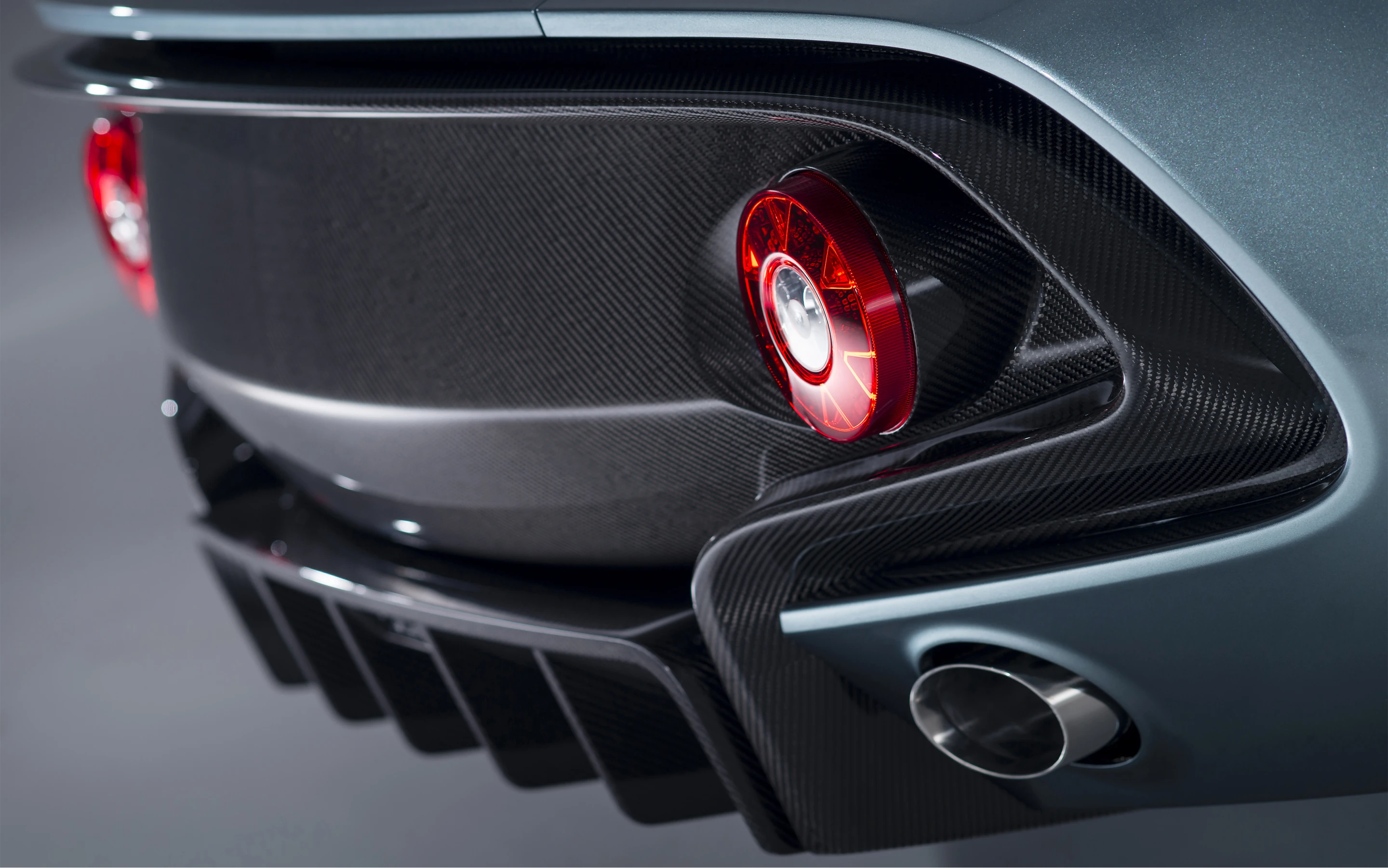 Diffuser and rear verticals incorporate carbon fiber for weight reduction and enhanced coolness factor