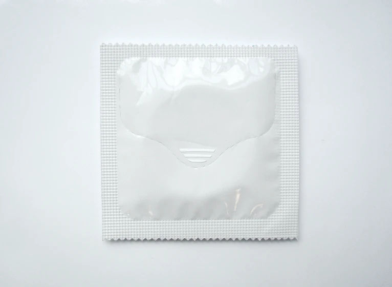 The One-Handed Condom's wrapper has a perforated seam along the front and a small ridge to grip it easily