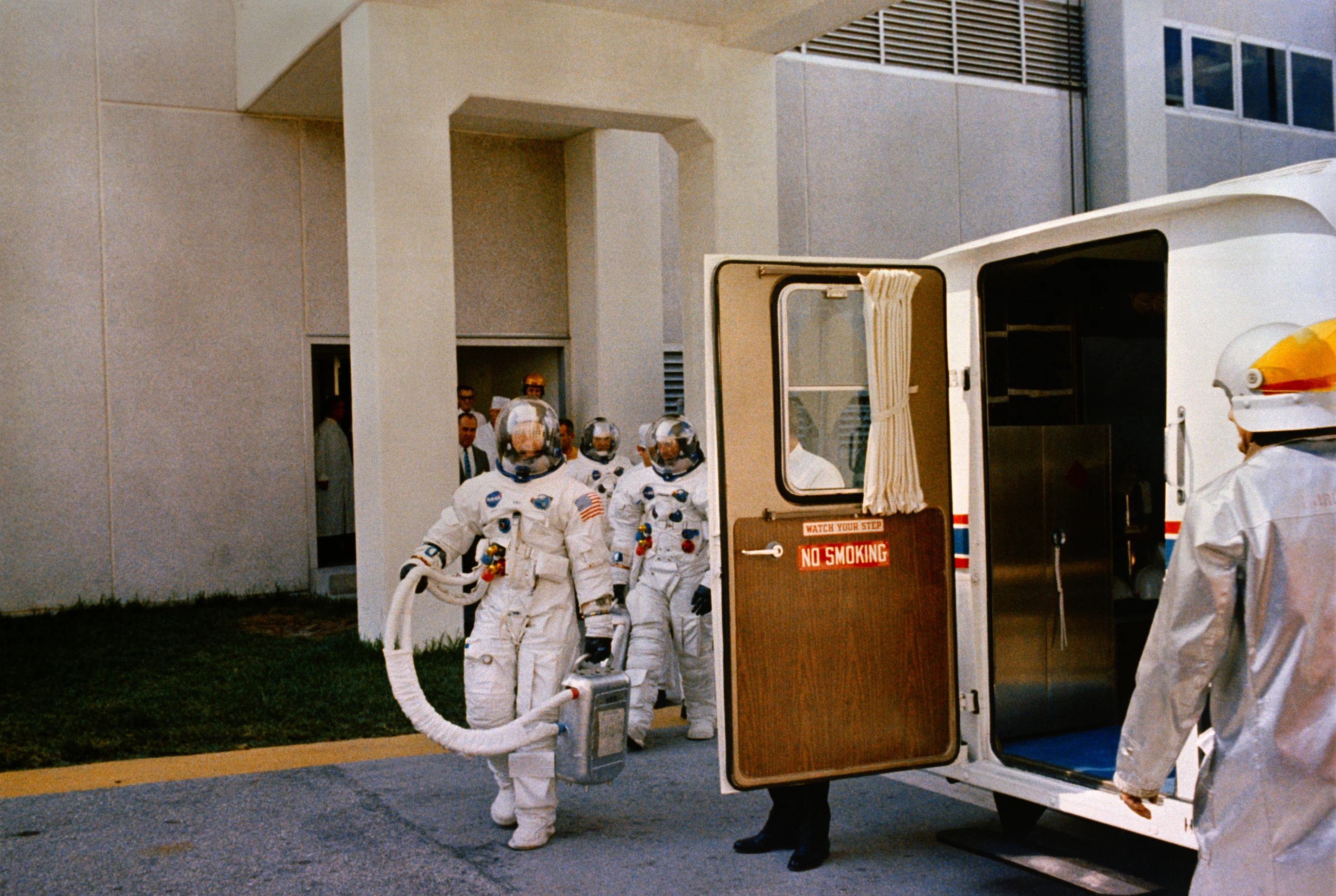 Command Module 101 Apollo 7 prime flight crew entering transfer van