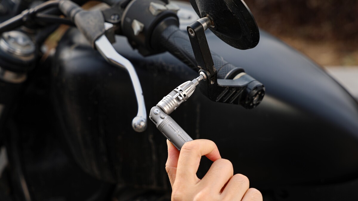 Titanium pocket tool bends four ways to ratchet drive any screw