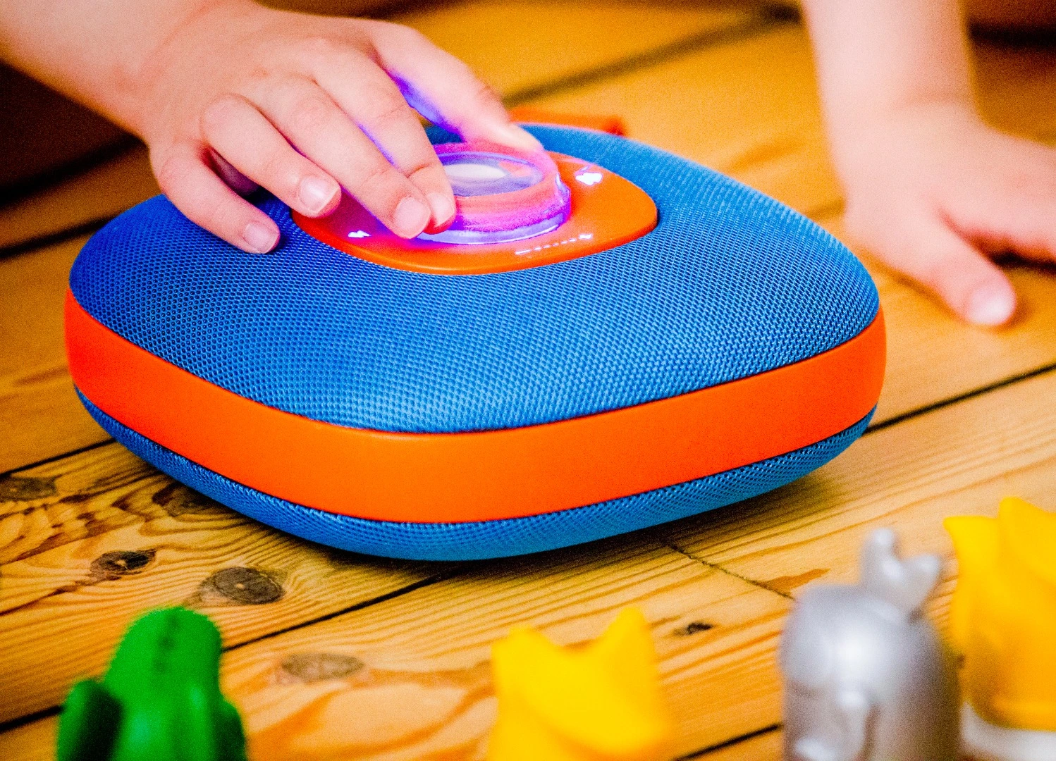 Children can start music playing on the Jooki wireless speaker by placing a star token or figurine on the center of the device
