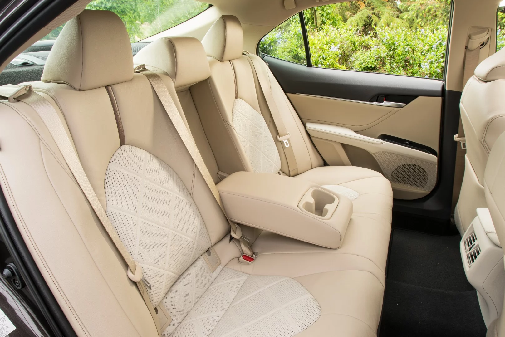 The rear seats in the 2018 Toyota Camry are plush and comfortable with enough room for three across, even if they're adults