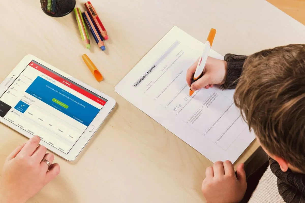 The KIHT system will combine a smart pen (right) and an app which teaches handwriting