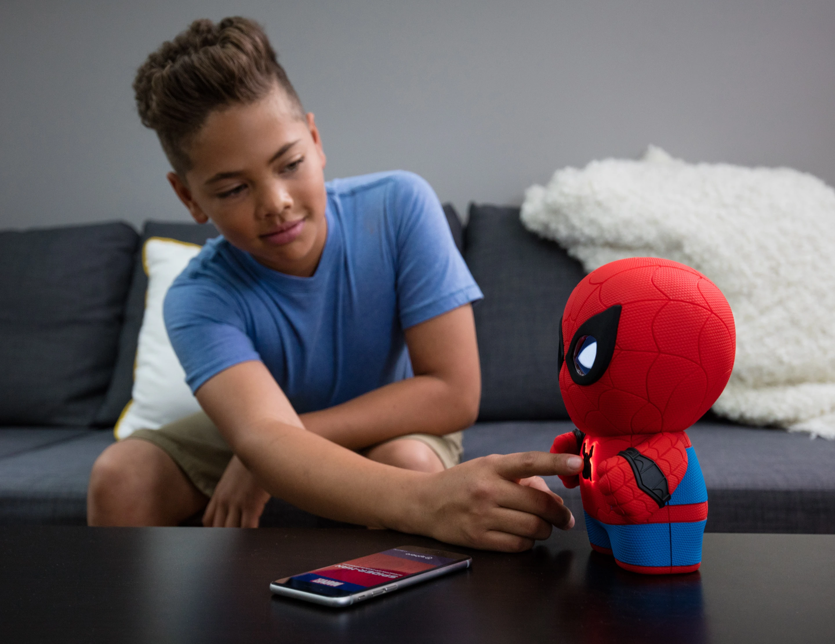 Pressing a button the chest of the Sphero Spider-Man toy activates the voice recognition