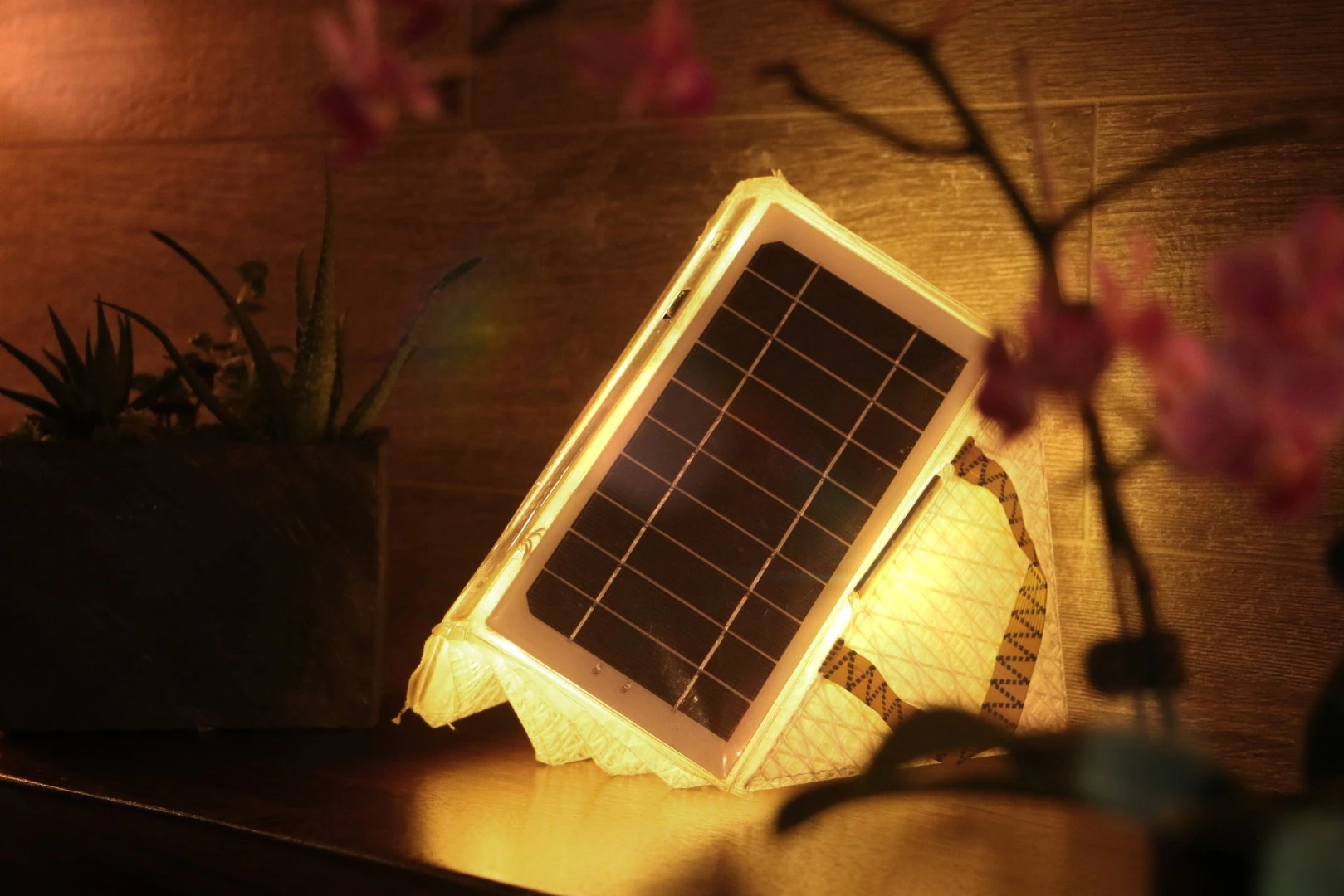 Qwnn can be recharged through two solar panels