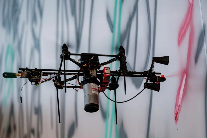 Each drone was equipped with a paint tank and a spray nozzle