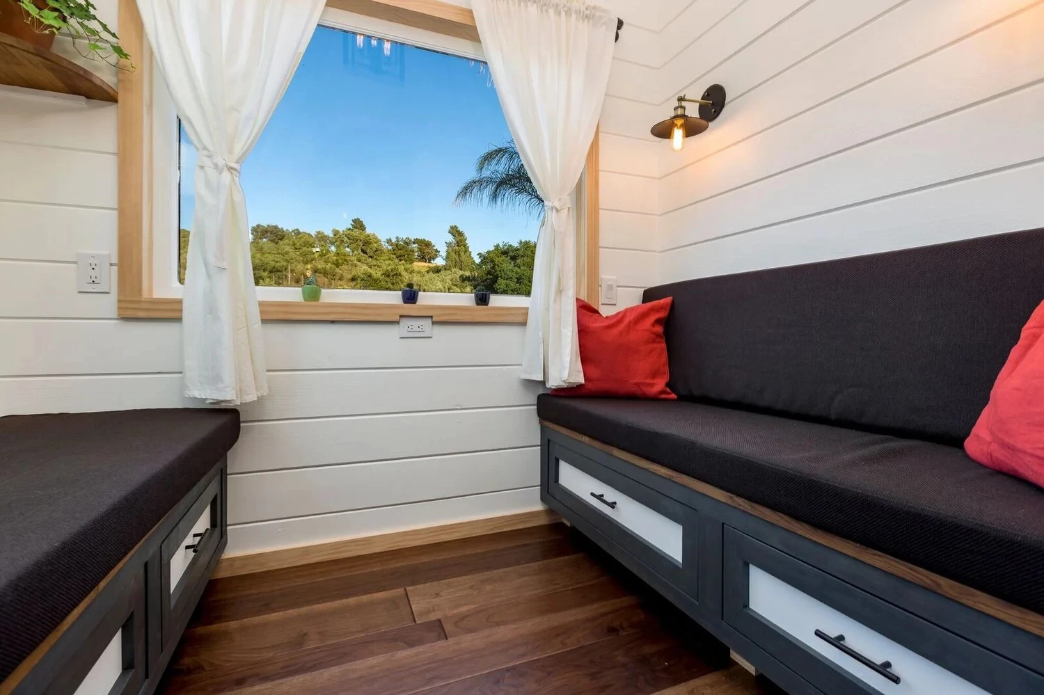The Joshua Tree's living room includes two sofas which have integrated storage and can be converted into a large bed