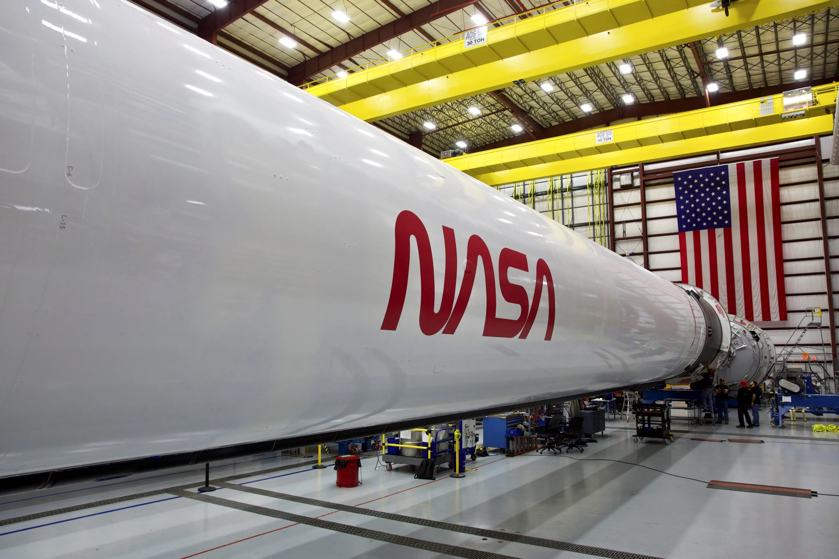 The Falcon 9 rocket with the NASA "worm" logo