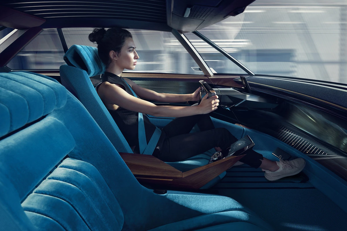 Bored of sitting still? Deploy the steering wheel and take back control from the Peugeot e-Legend's automated systems