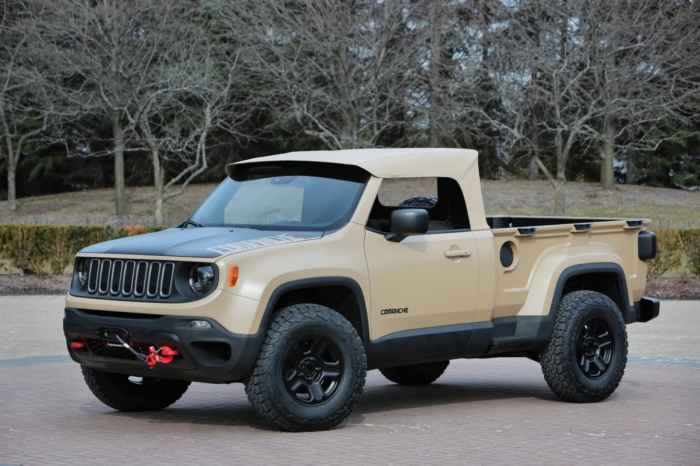 The canvas roof both pay homage to Jeep's military past