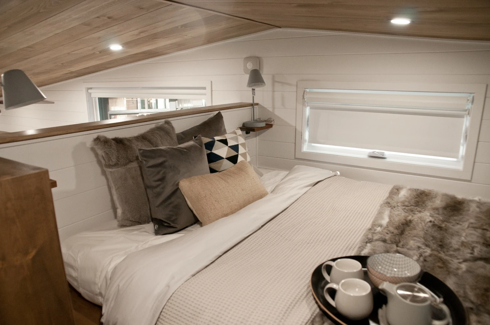 The Noyer's bedroom is a typical tiny house-style loft bedroom with a low ceiling