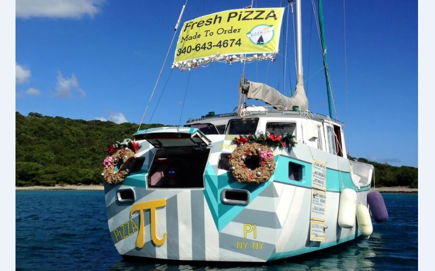 Sasha and Tara Bouis have transformed an abandoned aluminum sailboat into a floating pizza shop
