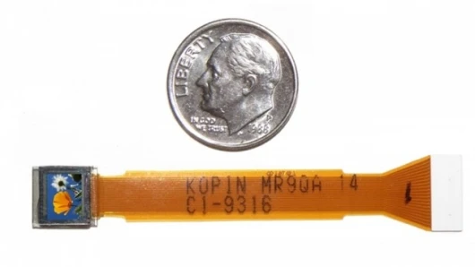 Kopin’s tiny CyberDisplay VGA display compared to the size of a U.S. dime