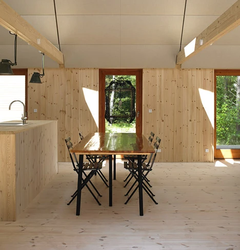 The 100 sq m (1076 sq ft) home was built for two families (8 occupants) and includes a large central family room with kitchen