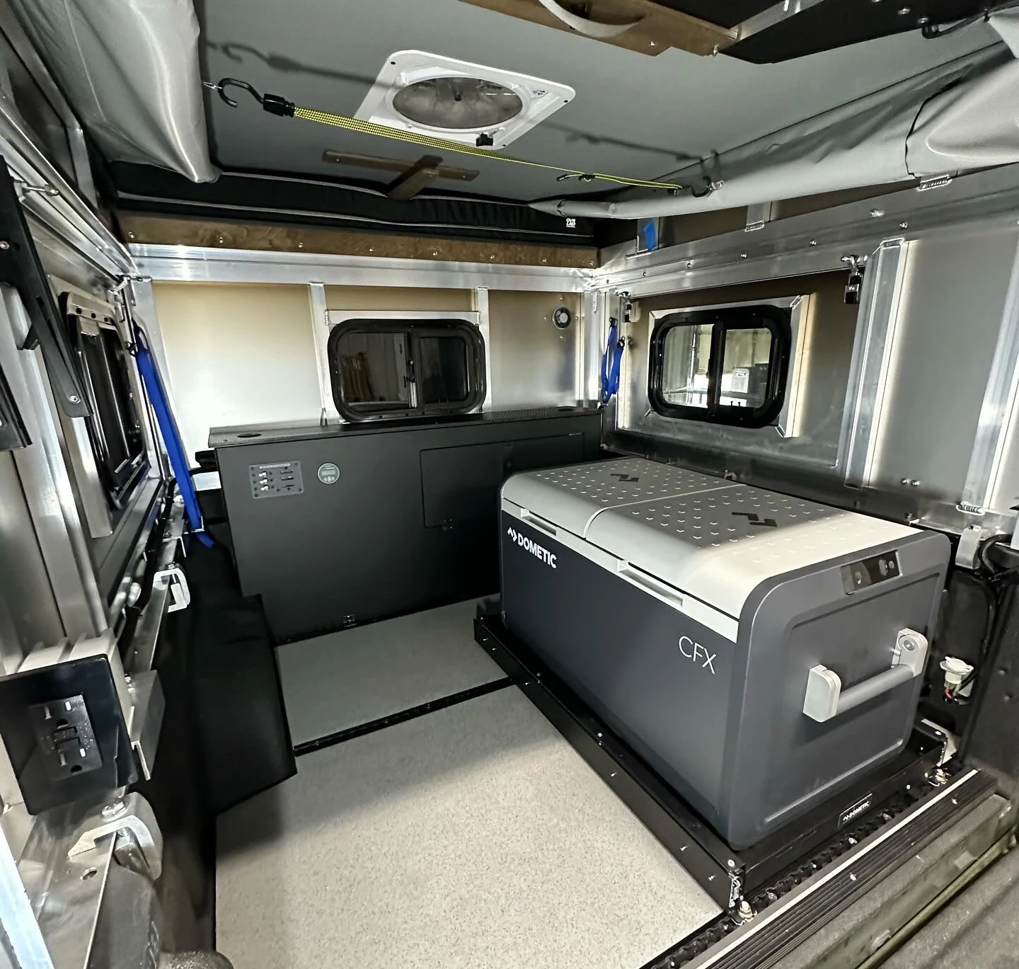 Jeep Gladiator with Catapult floor, front console, third-party topper and slide-out fridge setup