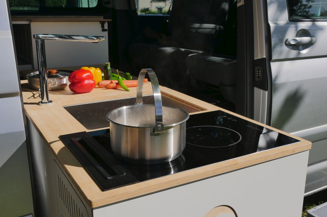 When not in use, the sink faucet drops and retracts away